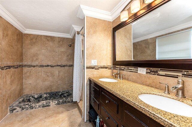 6797 SW 40th St Unit 71, Davie, FL 33314 - full bath featuring tiled shower, double vanity, ornamental molding, decorative backsplash, and tile walls