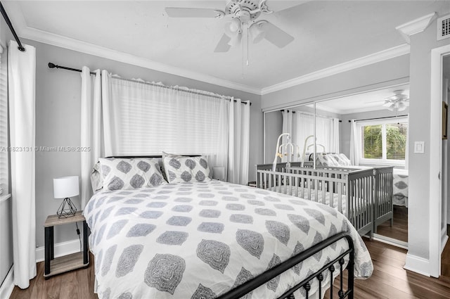 6797 SW 40th St Unit 71, Davie, FL 33314 - bedroom featuring wood finished floors, ornamental molding, and a ceiling fan
