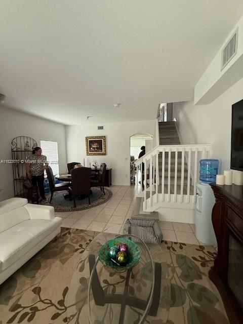 8960 W Flagler St Unit 1, Miami, FL 33174 - living area with stairway and tile patterned floors