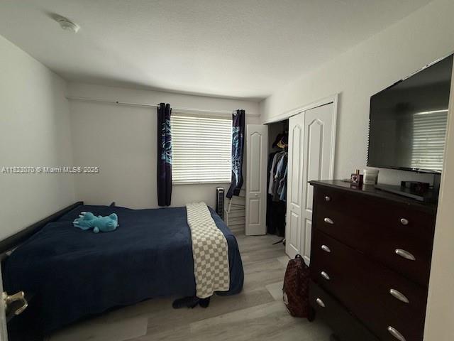 8960 W Flagler St Unit 1, Miami, FL 33174 - bedroom with a closet and light wood finished floors