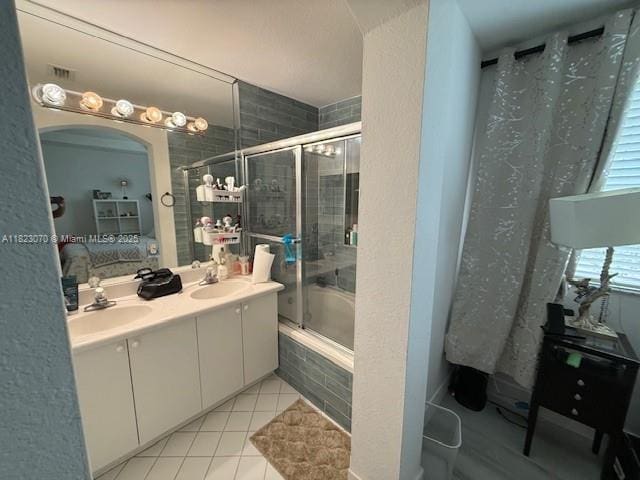 8960 W Flagler St Unit 1, Miami, FL 33174 - bathroom featuring ensuite bath, double vanity, tiled shower / bath combo, and tile patterned flooring