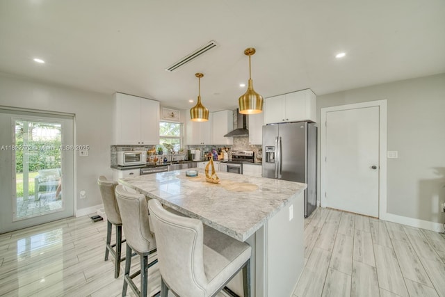 9104 SW 180th St, Palmetto Bay, FL 33157 - kitchen featuring stainless steel appliances, wall chimney exhaust hood, backsplash, a kitchen island, and recessed lighting
