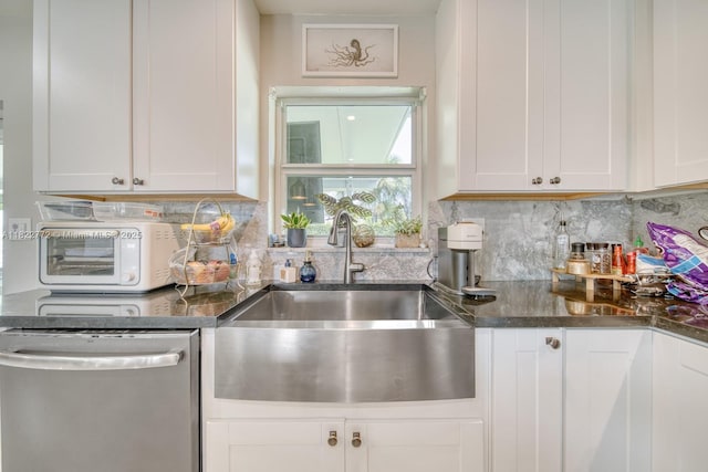 9104 SW 180th St, Palmetto Bay, FL 33157 - kitchen featuring stainless steel dishwasher, white cabinetry, decorative backsplash, and dark stone countertops