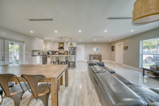 9104 SW 180th St, Palmetto Bay, FL 33157 - dining area featuring recessed lighting, healthy amount of natural light, and light wood finished floors