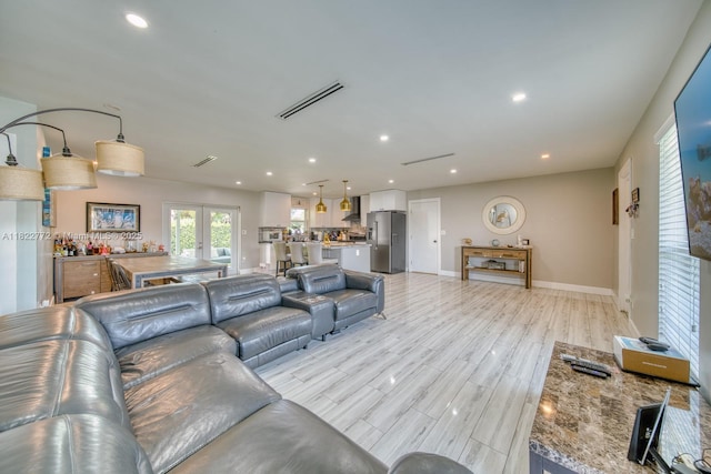 9104 SW 180th St, Palmetto Bay, FL 33157 - living room featuring recessed lighting and light wood-style flooring