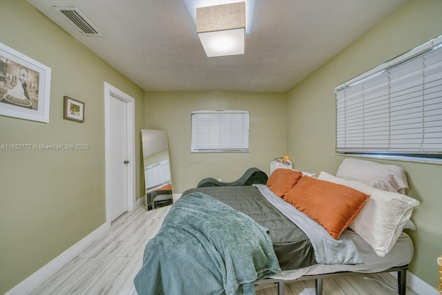 9104 SW 180th St, Palmetto Bay, FL 33157 - bedroom featuring wood finished floors and baseboards