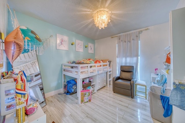 9104 SW 180th St, Palmetto Bay, FL 33157 - bedroom featuring a chandelier, wood finished floors, and a textured ceiling