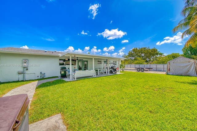 9104 SW 180th St, Palmetto Bay, FL 33157 - back of house featuring ceiling fan, a patio, a fenced backyard, and stucco siding