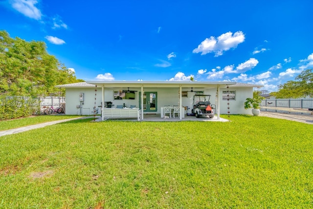 9104 SW 180th St, Palmetto Bay, FL 33157 - rear view of house featuring ceiling fan, stucco siding, a patio, and an attached carport