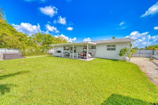 9104 SW 180th St, Palmetto Bay, FL 33157 - back of house with ceiling fan, stucco siding, a fenced backyard, and a patio