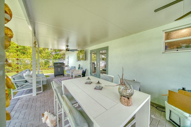 9104 SW 180th St, Palmetto Bay, FL 33157 - view of patio / terrace featuring french doors, area for grilling, outdoor dining space, and a ceiling fan