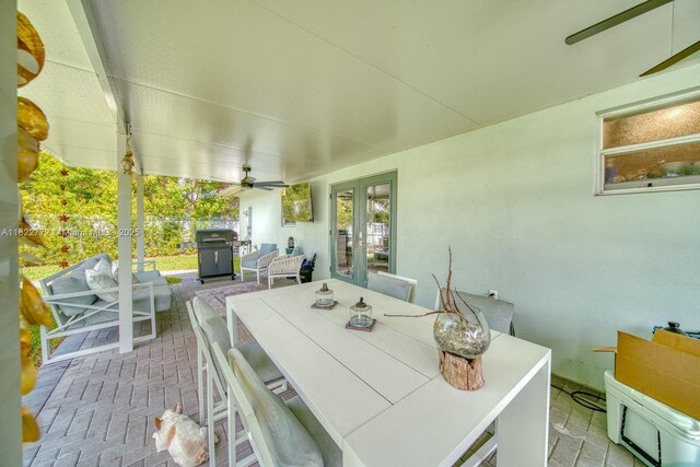 9104 SW 180th St, Palmetto Bay, FL 33157 - view of patio / terrace featuring french doors, area for grilling, outdoor dining space, and a ceiling fan