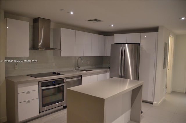 1600 NE 1st Ave Unit 1611, Miami, FL 33132 - kitchen with wall chimney range hood, stainless steel appliances, modern cabinets, light countertops, and decorative backsplash