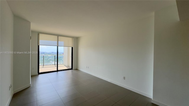 1600 NE 1st Ave Unit 1611, Miami, FL 33132 - unfurnished room featuring floor to ceiling windows and dark tile patterned flooring