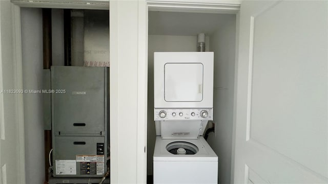 1600 NE 1st Ave Unit 1611, Miami, FL 33132 - washroom with stacked washing machine and dryer and heating unit