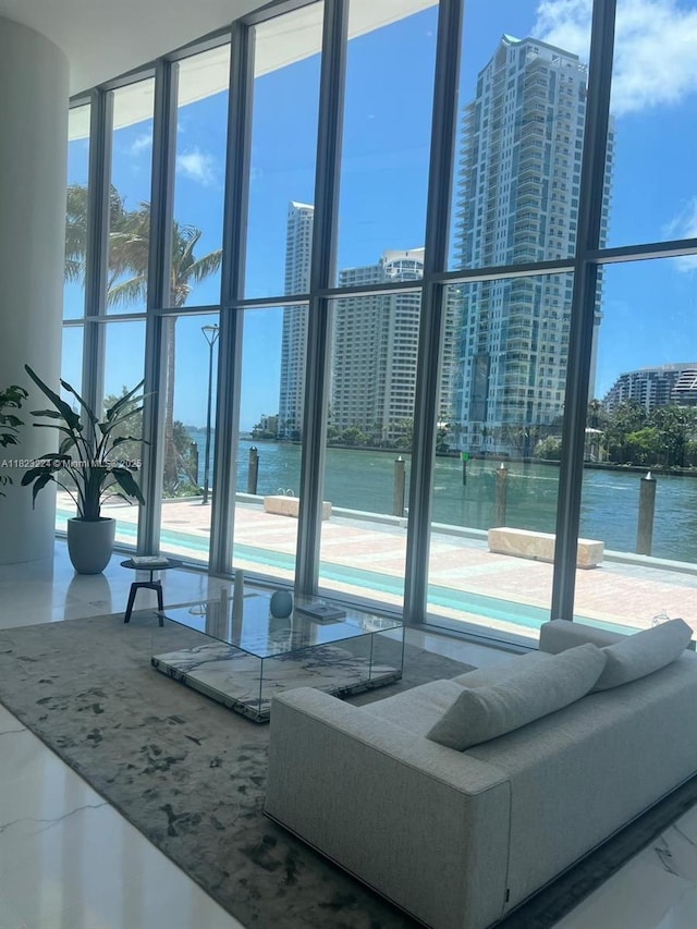 300 Biscayne Blvd Way Unit 5009, Miami, FL 33131 - living area with a view of city, expansive windows, plenty of natural light, marble finish floors, and a water view