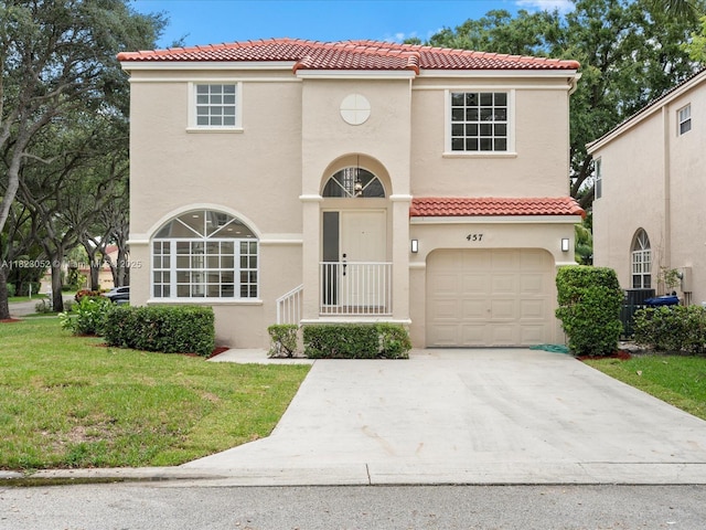 457 NW 87th Ln, Coral Springs, FL 33071 - mediterranean / spanish home featuring a tiled roof, stucco siding, a garage, and a front lawn