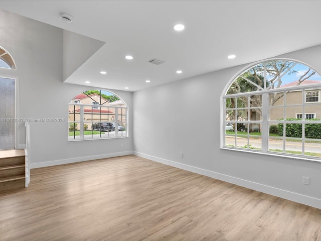 457 NW 87th Ln, Coral Springs, FL 33071 - spare room featuring recessed lighting, plenty of natural light, a smoke detector, light wood-type flooring, and stairs