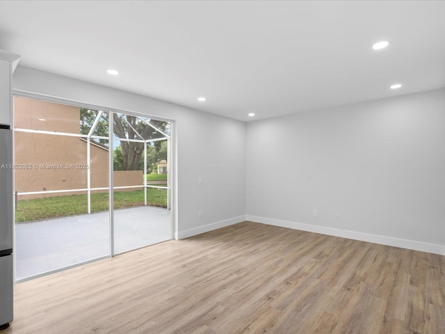 457 NW 87th Ln, Coral Springs, FL 33071 - unfurnished room featuring recessed lighting and light wood-style floors