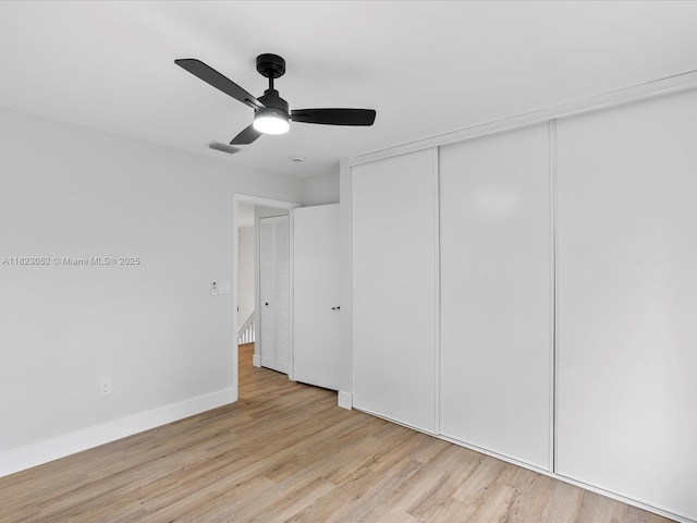 457 NW 87th Ln, Coral Springs, FL 33071 - unfurnished bedroom featuring light wood-type flooring, a closet, and a ceiling fan