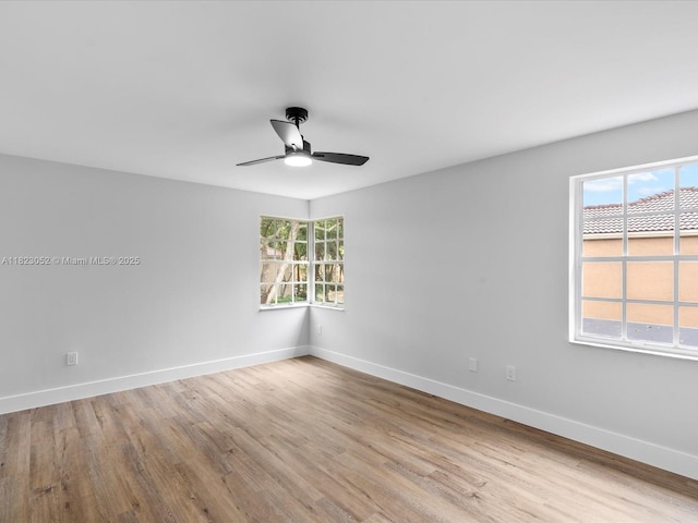 457 NW 87th Ln, Coral Springs, FL 33071 - unfurnished room with a ceiling fan and wood finished floors