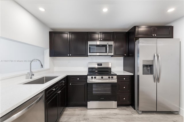 555 NE 15th St Unit 29F, Miami, FL 33132 - kitchen featuring stainless steel appliances, light countertops, light wood-type flooring, and recessed lighting