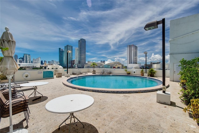 555 NE 15th St Unit 29F, Miami, FL 33132 - community pool with a skyline view and a patio area