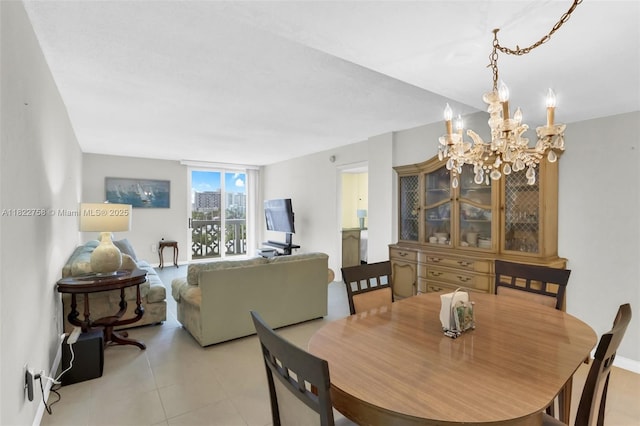 1020 Meridian Ave Unit 616, Miami Beach, FL 33139 - dining space featuring a chandelier and light tile patterned floors