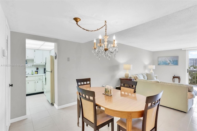 1020 Meridian Ave Unit 616, Miami Beach, FL 33139 - dining space with a chandelier and light tile patterned floors