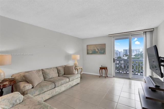 1020 Meridian Ave Unit 616, Miami Beach, FL 33139 - living room featuring a textured ceiling and tile patterned flooring