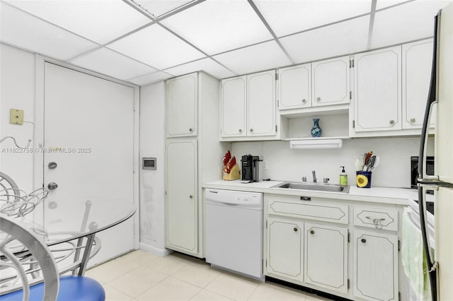 1020 Meridian Ave Unit 616, Miami Beach, FL 33139 - kitchen with white appliances, a paneled ceiling, light countertops, light tile patterned flooring, and open shelves