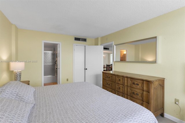 1020 Meridian Ave Unit 616, Miami Beach, FL 33139 - bedroom featuring a textured ceiling and baseboards