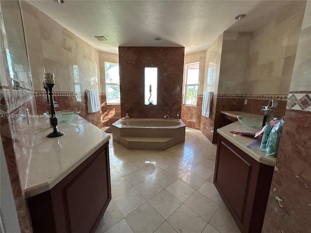 13190 NW 6th St, Miami, FL 33182 - bathroom with tile walls, two vanities, and a bath