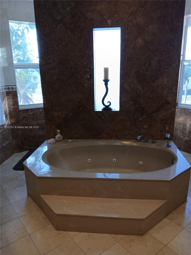 13190 NW 6th St, Miami, FL 33182 - bathroom with plenty of natural light, a jetted tub, tile walls, and tile patterned floors