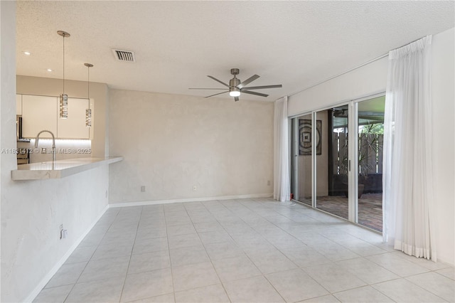 1654 SW 109th Ter, Davie, FL 33324 - unfurnished living room featuring ceiling fan, light tile patterned floors, recessed lighting, and a textured ceiling