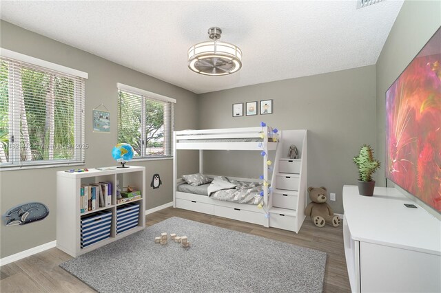 1654 SW 109th Ter, Davie, FL 33324 - bedroom with wood finished floors and a textured ceiling