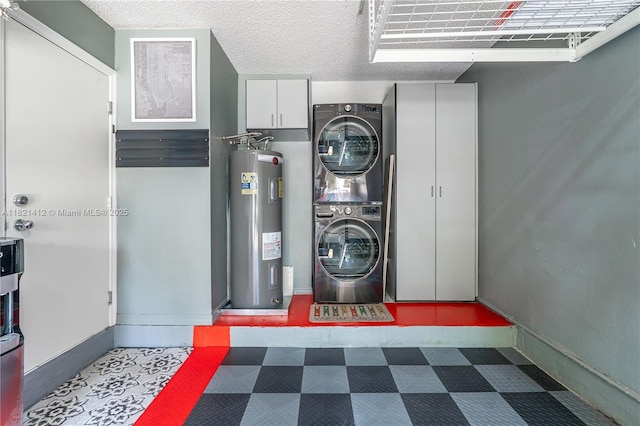1654 SW 109th Ter, Davie, FL 33324 - washroom with estacked washer and dryer, electric water heater, tile patterned floors, and cabinet space
