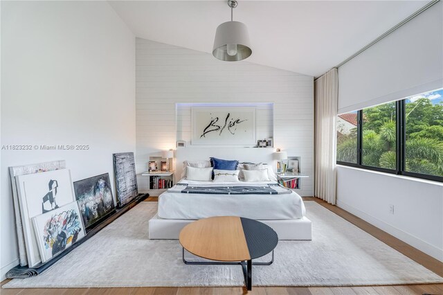 2000 S Bayshore Dr Unit 47, Miami, FL 33133 - bedroom featuring vaulted ceiling and wood finished floors