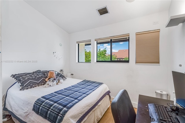 2000 S Bayshore Dr Unit 47, Miami, FL 33133 - bedroom with lofted ceiling and wood finished floors