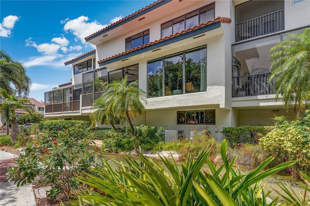 2000 S Bayshore Dr Unit 47, Miami, FL 33133 - back of property with stucco siding and a tile roof