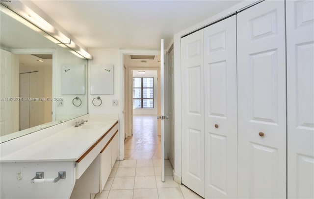 3500 Mystic Pointe Dr Unit 1207, Aventura, FL 33180 - bathroom featuring a closet, tile patterned floors, and vanity