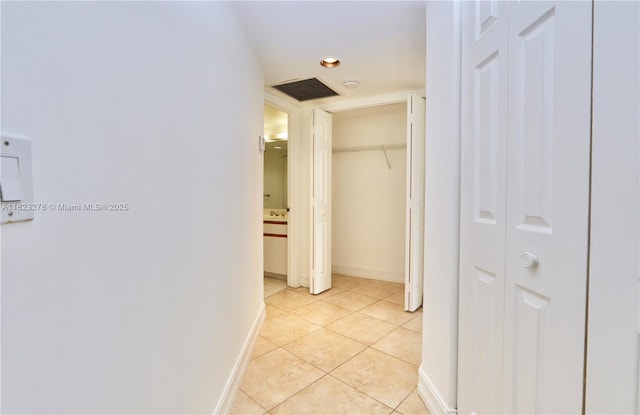 3500 Mystic Pointe Dr Unit 1207, Aventura, FL 33180 - hall featuring light tile patterned floors and baseboards