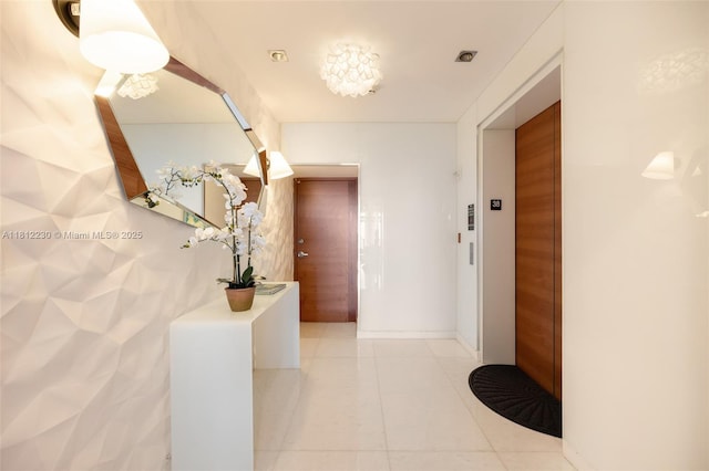 480 NE 31st St Unit 3802, Miami, FL 33137 - hallway featuring elevator and light tile patterned floors