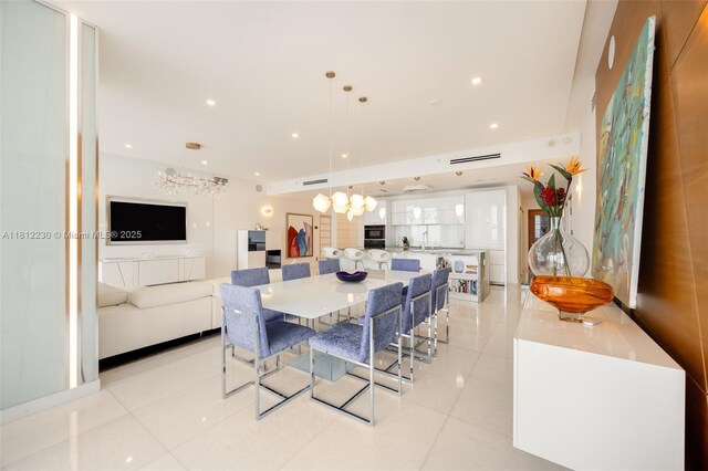 480 NE 31st St Unit 3802, Miami, FL 33137 - dining room with a chandelier, light tile patterned floors, and recessed lighting