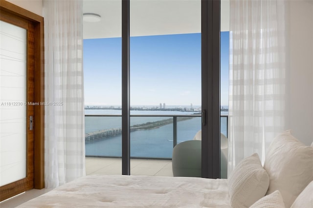 480 NE 31st St Unit 3802, Miami, FL 33137 - bedroom with a water view and tile patterned floors