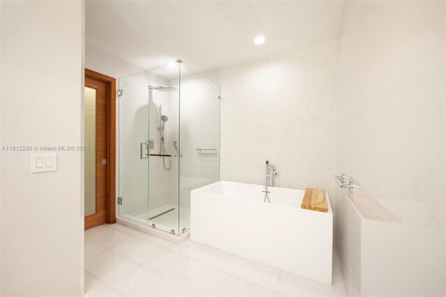 480 NE 31st St Unit 3802, Miami, FL 33137 - full bath featuring a shower stall, a freestanding bath, and tile patterned flooring