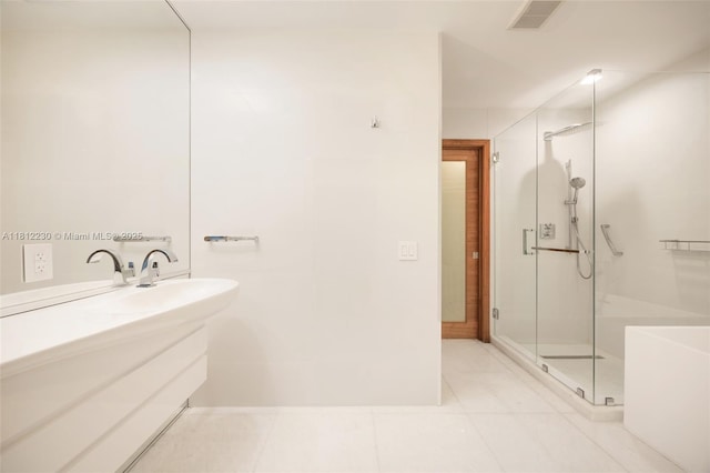 480 NE 31st St Unit 3802, Miami, FL 33137 - bathroom with a stall shower, vanity, and tile patterned floors
