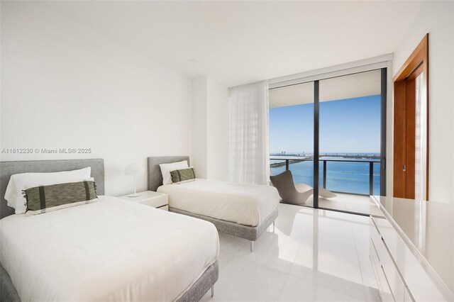 480 NE 31st St Unit 3802, Miami, FL 33137 - bedroom featuring expansive windows, access to exterior, and tile patterned floors