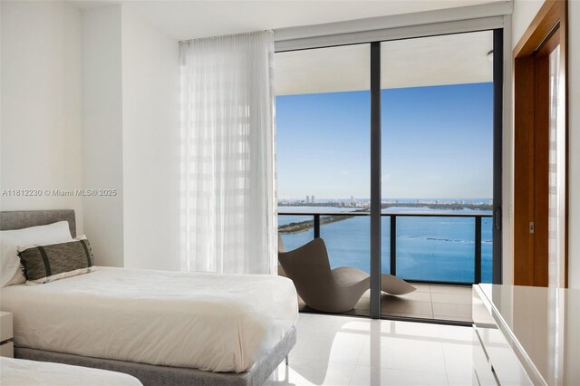 480 NE 31st St Unit 3802, Miami, FL 33137 - tiled bedroom featuring expansive windows and a water view