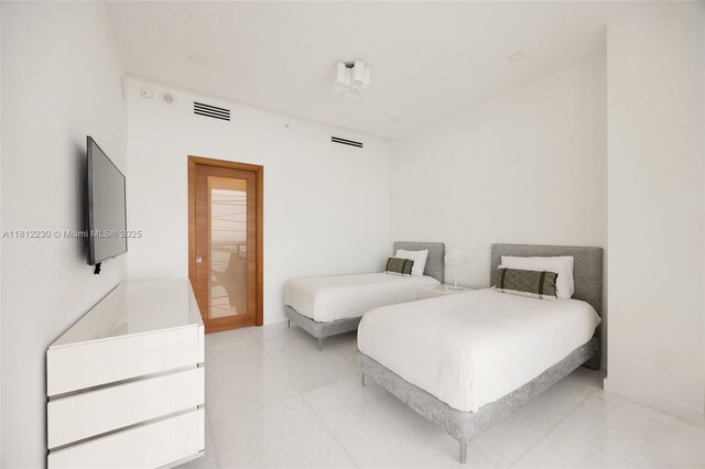 480 NE 31st St Unit 3802, Miami, FL 33137 - bedroom featuring baseboards and light tile patterned flooring